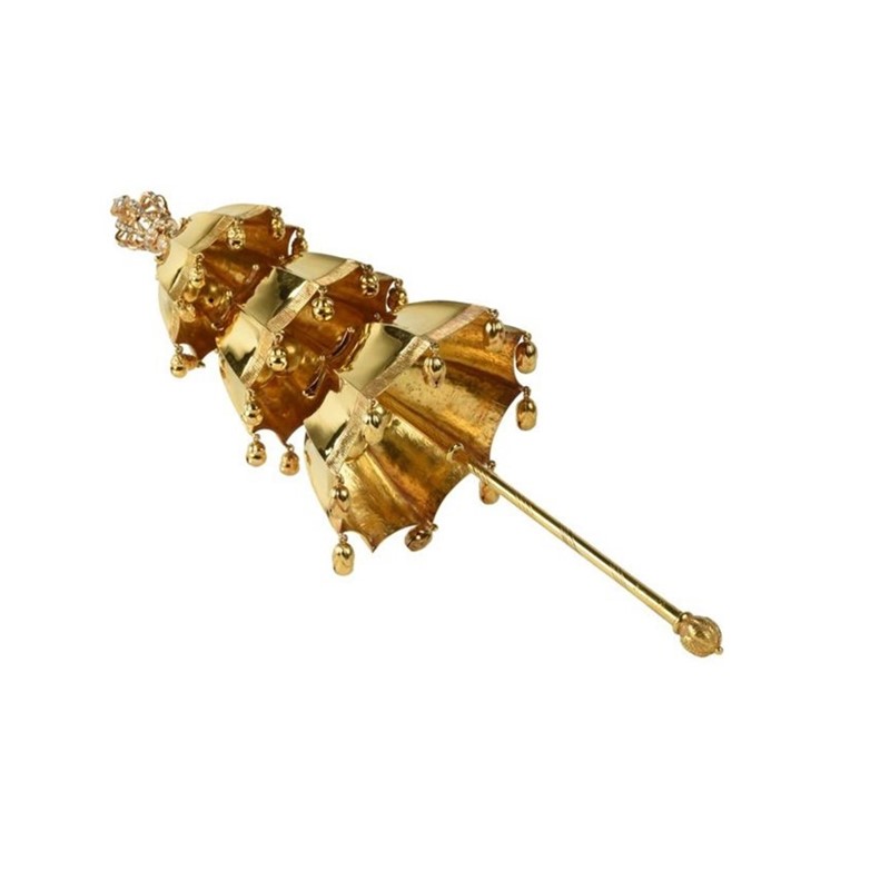 Gouden rammelaar van prinses Beatrix uit 1937, versierd met kleine belletjes en een gedetailleerd handvat. Collectie Koninklijke Verzamelingen Den Haag, getoond in de tentoonstelling In de ban van GOUD in Wereldmuseum Leiden.